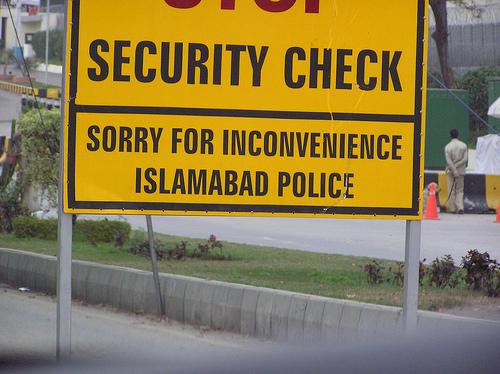 A sign advises of a police security checkpoint in Islamabad, Pakistan.