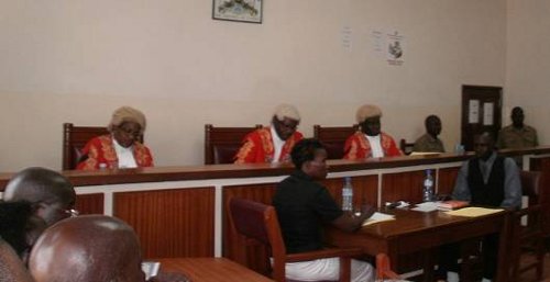The judges: Justice Nahamya, Justice Akiiza, Justice Owiny-Dollo