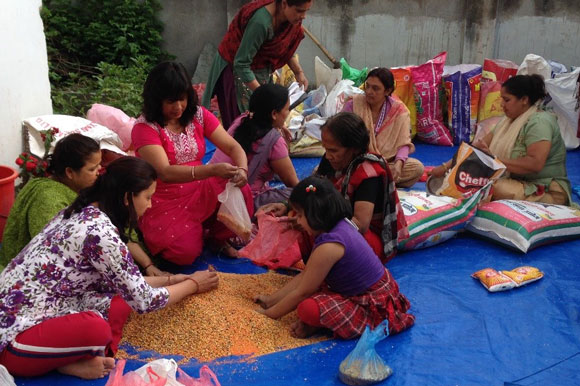 Women preparing relief materials for the victims of the April earthquake, credit: Ambika Pokhrel