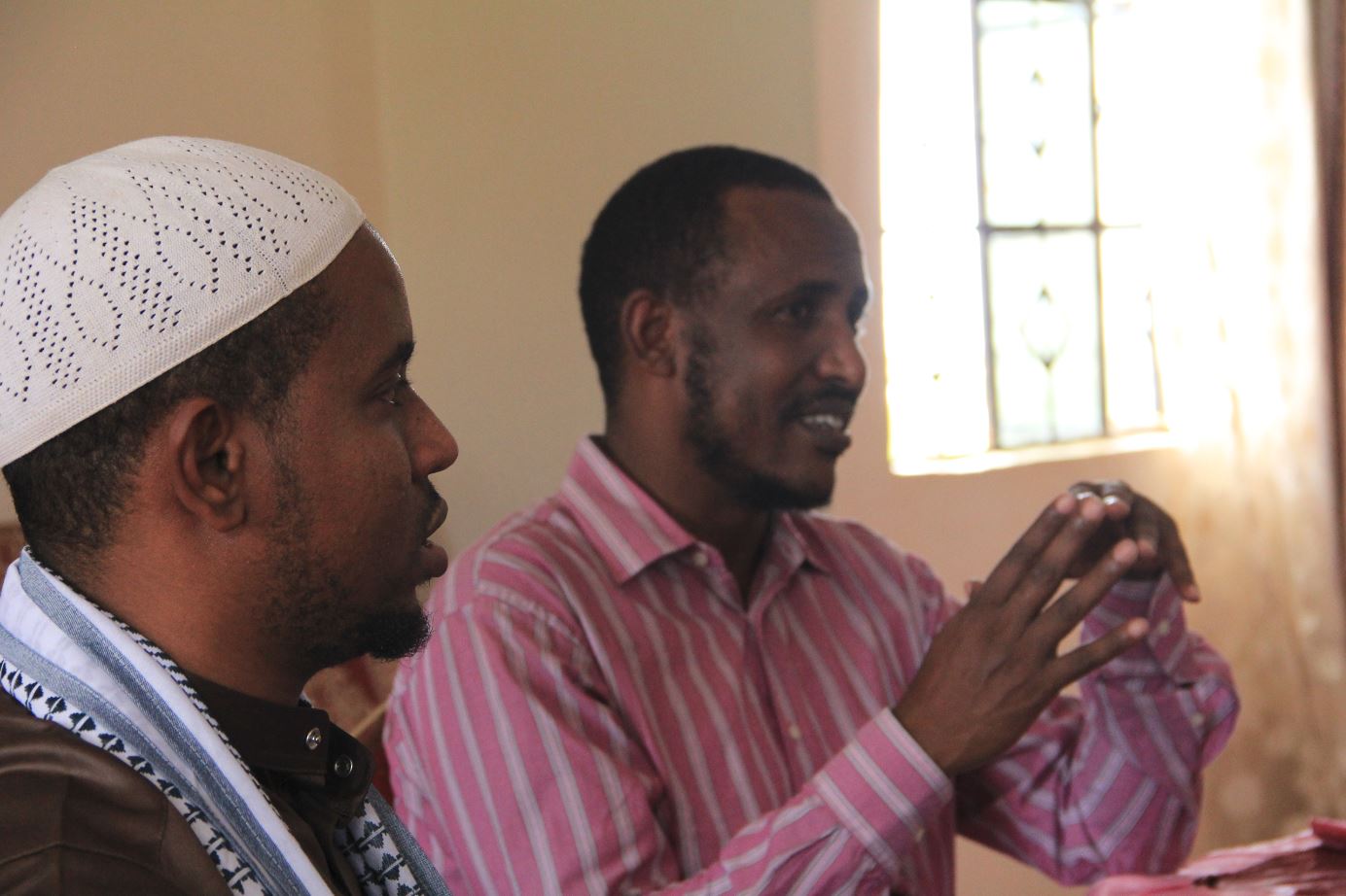 Hassan Ismail (right) was once victim to the conflict he is supporting local people to solve in Kenya through a new project run by Interpeace. Image: Interpeace