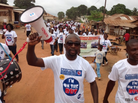 Young volunteers participate in the Liberia Bus Project campaign.